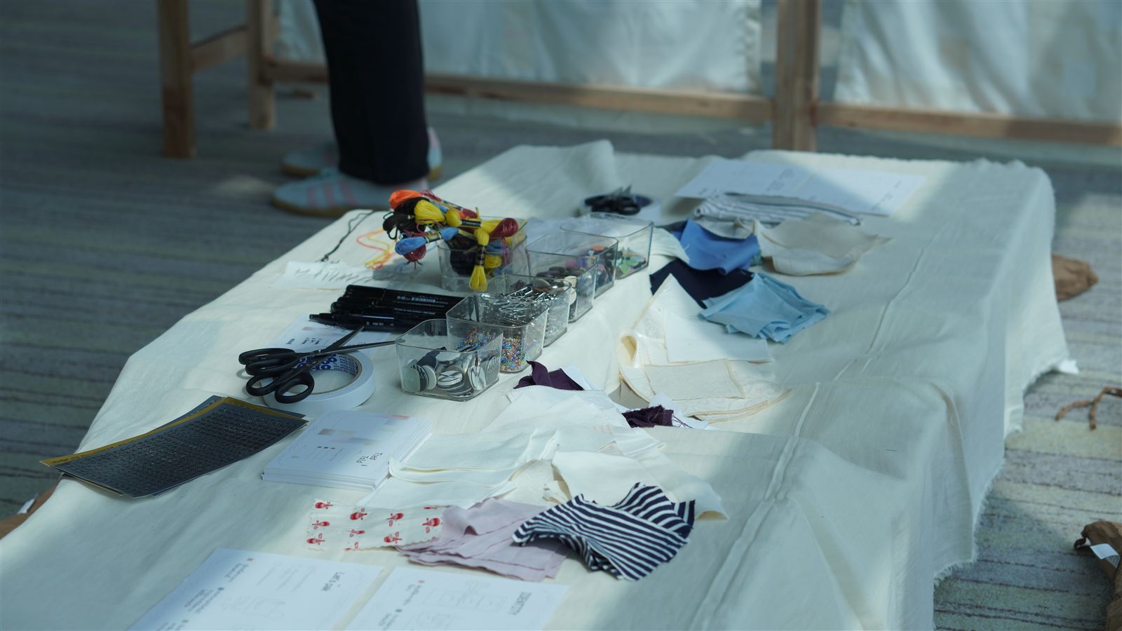 Guests seated and crafting in the Sewing Zone
